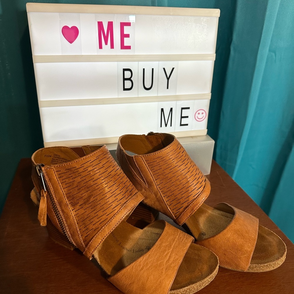 An exotic, one of a kind sandal with bold side zip.  The Milan by Sofft